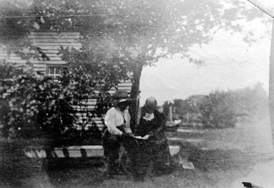 Gussie Willmott and Cousin Dorothy Willmott under apple tree at &quot;Rose Hill&quot; farm.