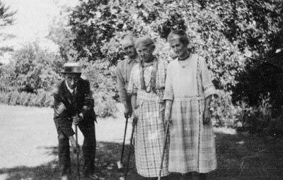 Rev. M. J. and Mrs. Wilson and Willmotts playing croquet.