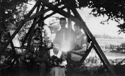 Family group on swing