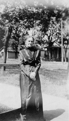 Elderly lady in long dark dress