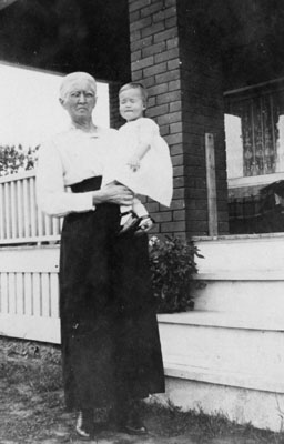 Elderly woman holding young child