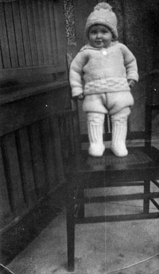 Young child standing on chair