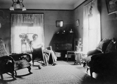 Woman sitting in chair in living room