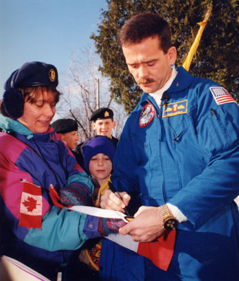 Chris Hadfield, astronaut, signing autographs in Milton