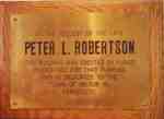 Memorial plaque on the public washrooms funded by P. L. Robertson's will.