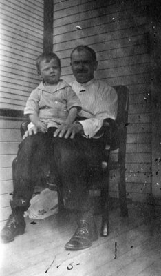 Man with young boy sitting on knee