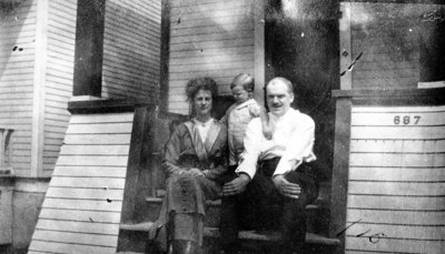 Family on steps of house