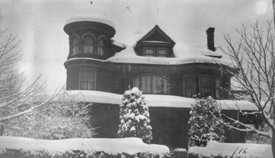 Large snow covered house