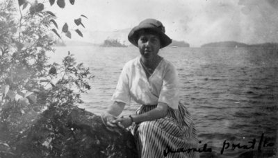 Lady sitting by lake