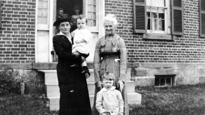 Family group outside house