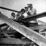 Man and three women on a bridge