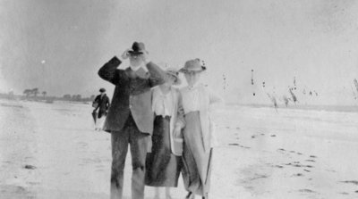 Man and two ladies on the beach