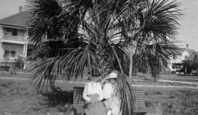 Two ladies sitting on a bench