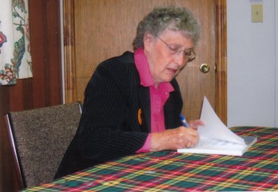 Gloria Brown signing copies of &quot;Halton's Scotch Block&quot; at the book launch