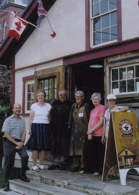 Members of the Milton Historical Society at the door of the Waldie Blacksmith Shop