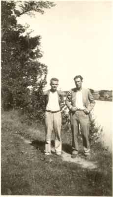 Two men standing by the Mill Pond