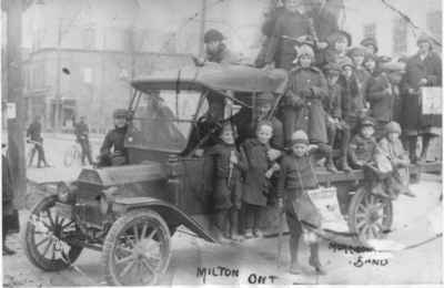 Children standing on car