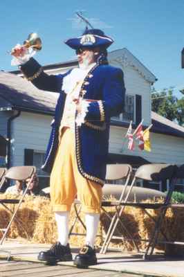 Town crier at the opening of the Waldie Blacksmith Shop