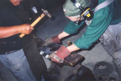 Blacksmiths making hinges