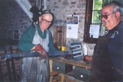 Blacksmiths making hinges