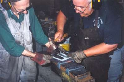 Larry Maughan and Darwyn Hourie making hinges