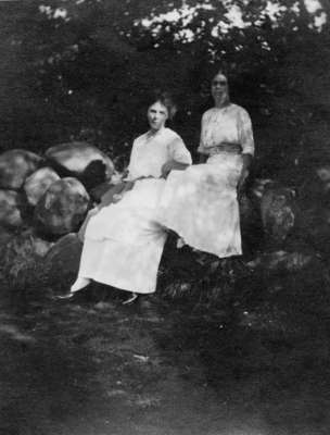 Tow ladies sitting on rocks