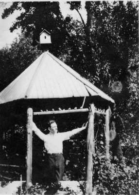 Man at wooden shelter