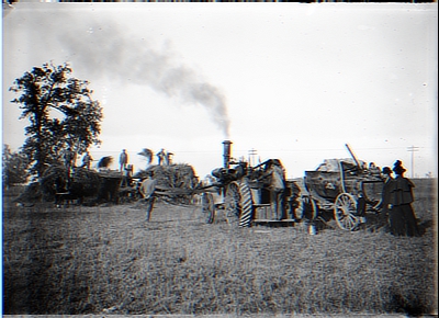 Workers on Hay Wagon; Man on Tractor; Man-Lady-Child