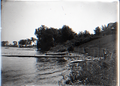 Piers in River; Sailboats