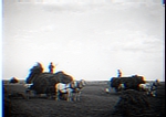 2 haywagons in field