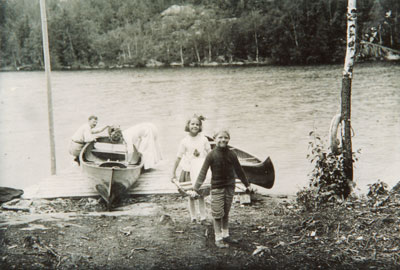 A Family Unloading their Canoes, circa 1920