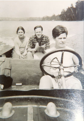 Young Woman Driving a Motorboat, circa 1920