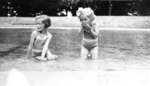 Betty & Ruth Huggins wading in pool in Fort Drummond, Queenston Heights Park. Not dated but probably in the early 1930s.