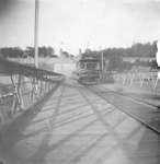 A trolley car of Niagara Falls Park and River Railway crossing Queenston-Lewiston Suspension Bridge