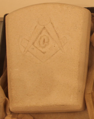 Stone embossed with the square and compasses