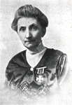 Elizabeth C. Ascher decorated with the Chevalier's Cross of the Order of Polonia Restituta