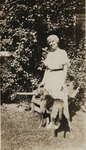Photograph of unidentified woman and dog