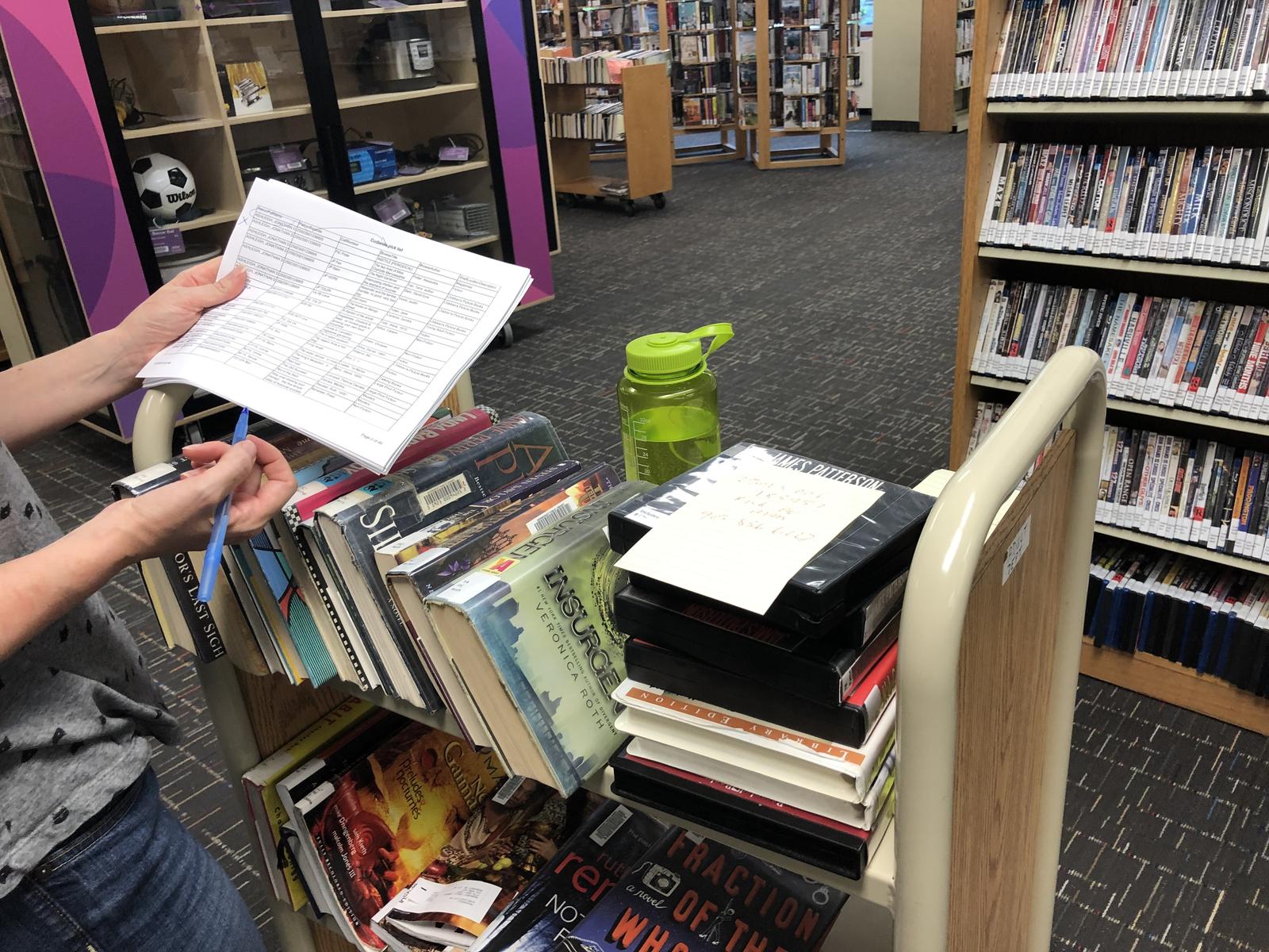Library staff gathering material for curbside pick up