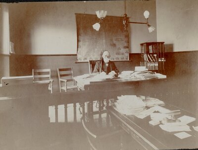 Man at desk at Woodstock Courthouse