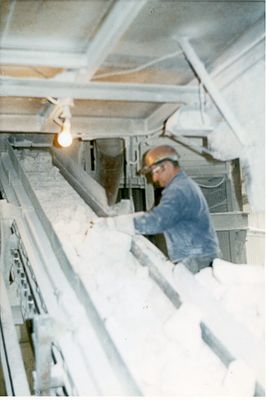 Worker sorting lime at the Dofasco Beachville Quarry