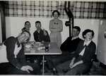 Members of Curries Drama Club seated in kitchen.