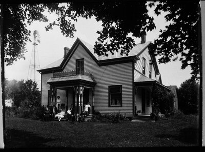 Group on front porch of Norwich home