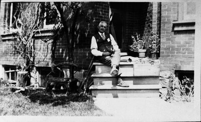 Man sitting on porch, Norwich