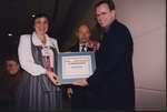 Ken Setterington receives the Ontario Library Trustees' Award from 1999 OLTA President Audrey Lawrence and 2000 OLTA President Robin Dunbar