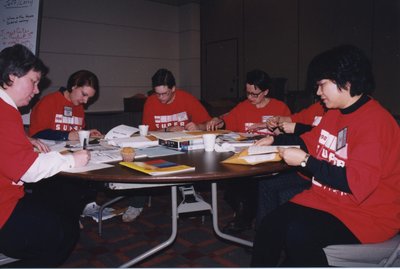 Volunteers collating session statistics