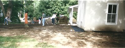 Levelling the area and laying sod