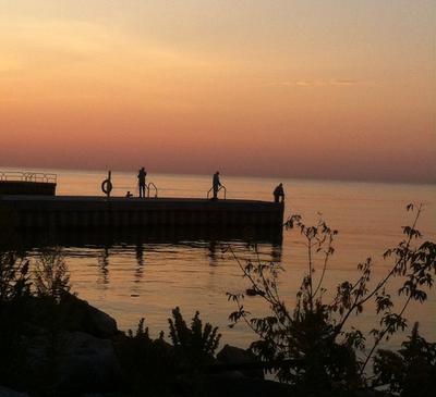 Fishing off the pier at Oakville Harbour