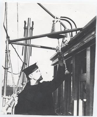 Sailor ringing ships bell