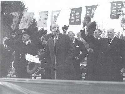 Dignitaries on reviewing stand at christening ceremony for HMCS Oakville, November 5, 1941