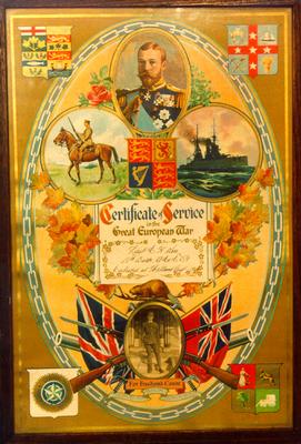 Framed certificate of service for Charles Kerr, First World War. A photograph of Charles Kerr in military uniform is contained within the certificate.